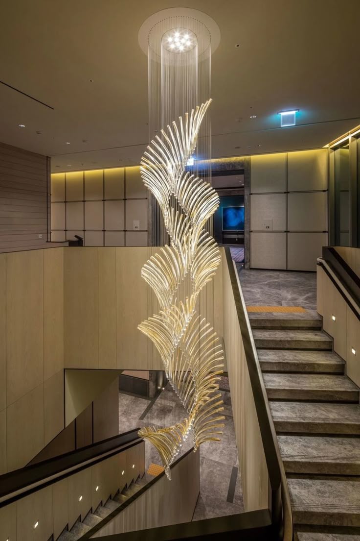Custom chandelier installation by Star Group Interiors in Kerala