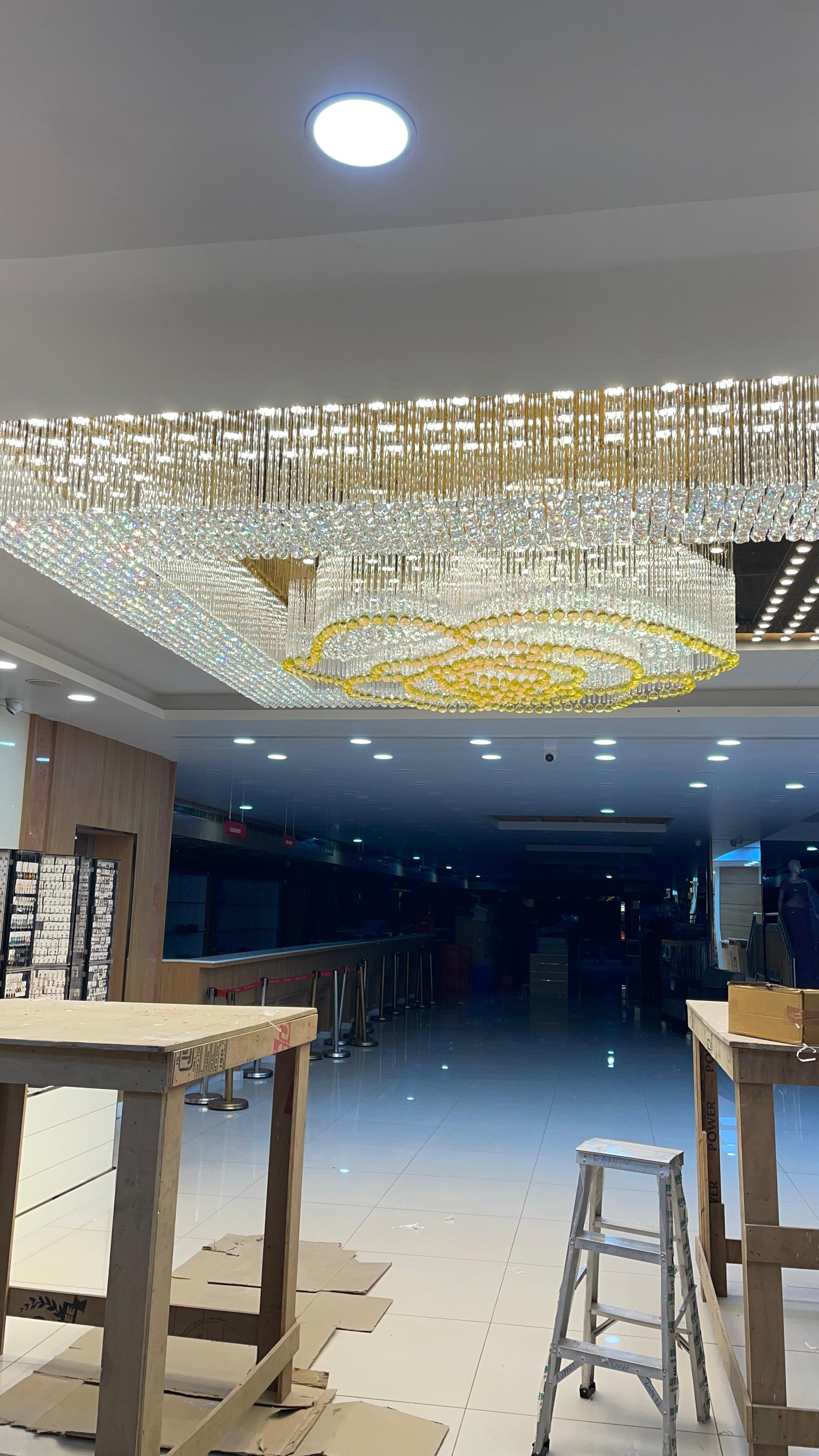 Yes Bharat commercial interior and lighting project in Karunagapally, Kerala by Star Group Interiors